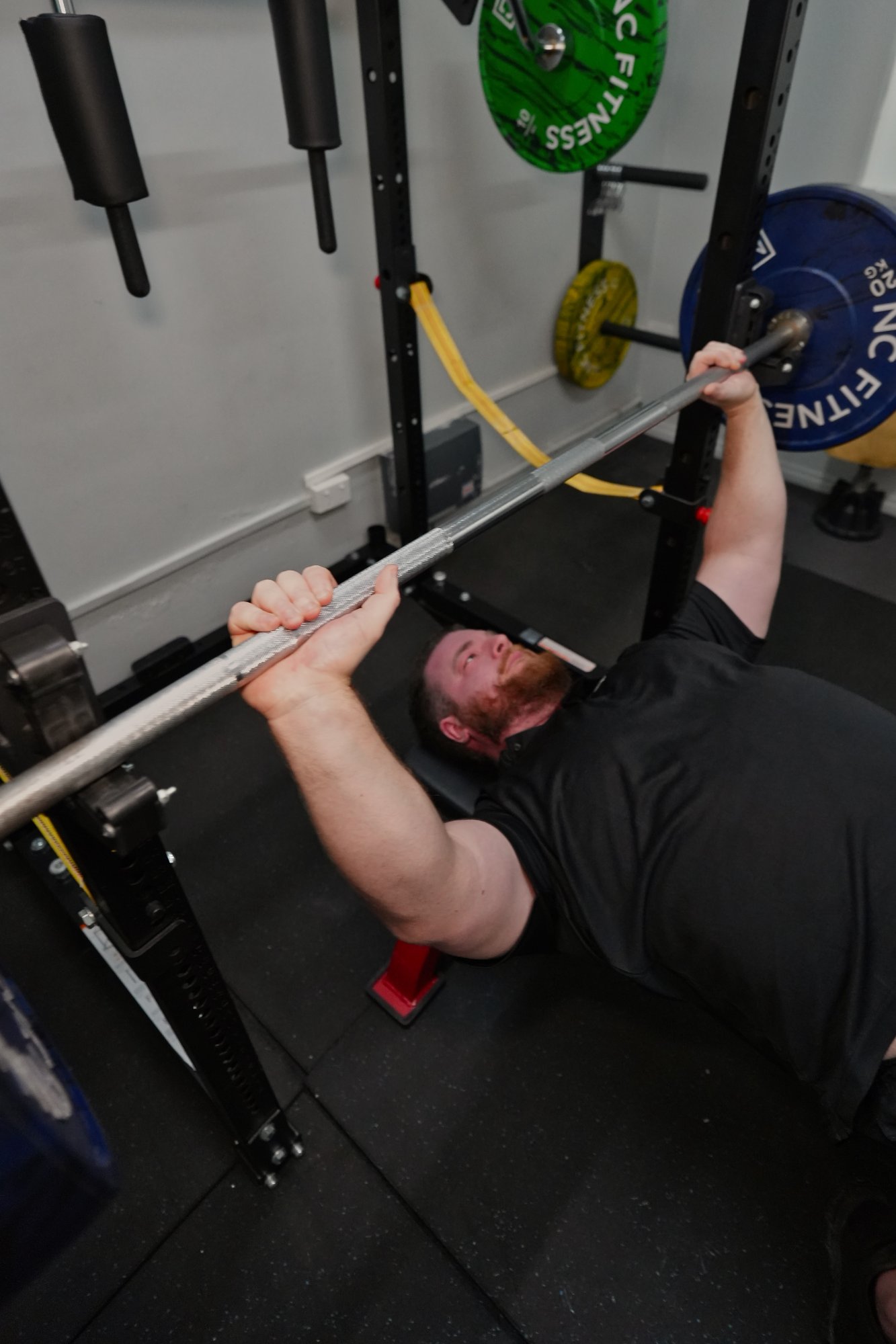 Exercise physiologist Jake working with veteran client at Black Site Fitness
